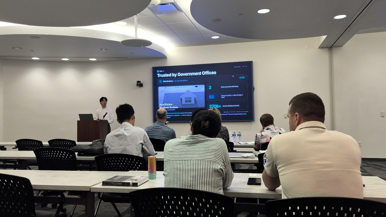 Peter presenting a product slide to an audience at the AWS pitch competition